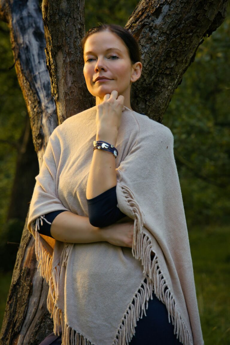 Serene portrait of a woman in a Berlin park, embracing nature's tranquility in autumn.